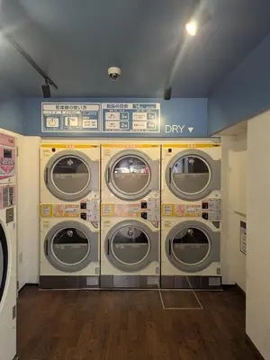 a bunch of washing machines in a laundry room at 15min from Haneda Airport Cozy for 3 in Tokyo