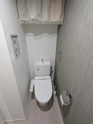 a small white toilet in a small bathroom at 15min from Haneda Airport Cozy for 3 in Tokyo