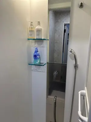 a bathroom with two bottles of soap and a sink at \u82b1\u306e\u91cc in Tokyo