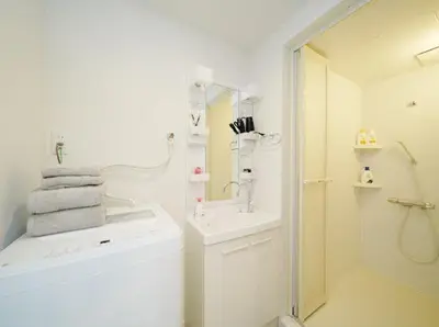 a white bathroom with a sink and a mirror at OpenSale Shinjuku 301 New Building 2mins to Waseda Station Max for 3 people in Tokyo