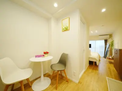 a room with a table and two chairs and a bed at OpenSale Shinjuku 302 New Build 2mins to Waseda Station Max for 2 people in Tokyo