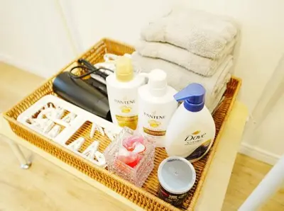 a basket with hygiene products and towels on a table at OpenSale Shinjuku 302 New Build 2mins to Waseda Station Max for 2 people in Tokyo