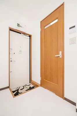 an empty room with a door and a mattress at Shinjuku Terrace 226 BnB in Tokyo