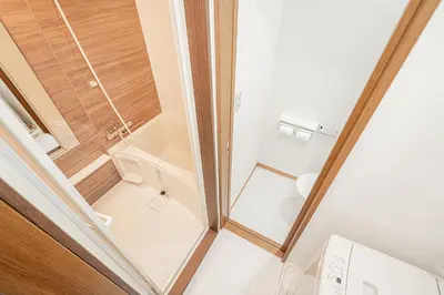 a small bathroom with a shower and a toilet at Shinjuku Terrace 226 BnB in Tokyo