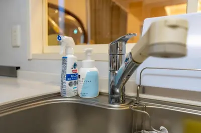 a sink with two bottles of toothpaste and a faucet at Tokyo Koiwa European Luxury Mansion 4 Bedrooms2 ToiletsEV HanedaNarita Direct Max 8 Guests in Tokyo
