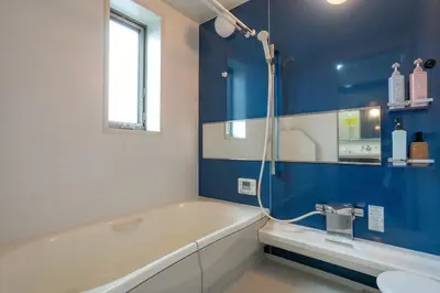 a bathroom with a tub and a toilet and a sink at Tokyo Koiwa European Luxury Mansion 4 Bedrooms2 ToiletsEV HanedaNarita Direct Max 8 Guests in Tokyo