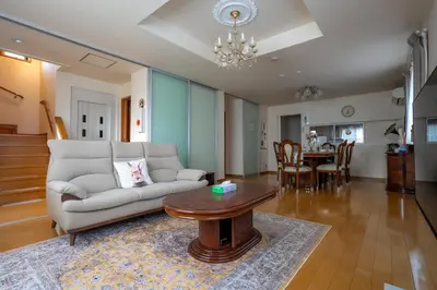 a living room with a couch and a table at Tokyo Koiwa European Luxury Mansion 4 Bedrooms2 ToiletsEV HanedaNarita Direct Max 8 Guests in Tokyo