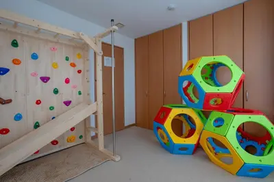 a bedroom with a bunk bed and a rock wall at Tokyo Koiwa European Luxury Mansion 4 Bedrooms2 ToiletsEV HanedaNarita Direct Max 8 Guests in Tokyo