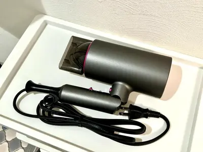 a blow dryer in a box with a cord at Yama Hotel Akabane 101 in Tokyo