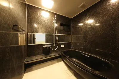 a black bathroom with a tub and a sink at YutoVillageHouse Sweetexperience in Ikebukuro YVM in Tokyo
