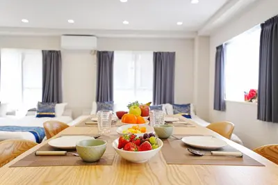a dining room with a table with fruit on it at Unite Stay URAYASU 101 8 minutes by car or 15 minutes by bus to Disneyland in Tokyo