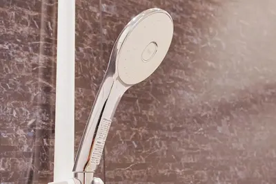 a shower head is attached to a wall at Unite Stay URAYASU 101 8 minutes by car or 15 minutes by bus to Disneyland in Tokyo
