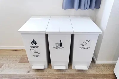 two white trash cans sitting next to each other at Unite Stay URAYASU 101 8 minutes by car or 15 minutes by bus to Disneyland in Tokyo