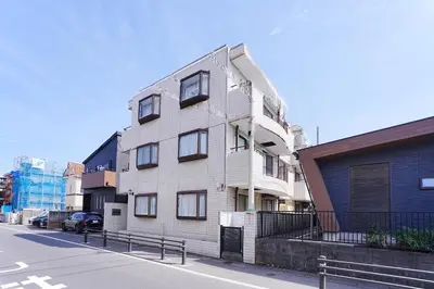 a white building on the side of a street at Unite Stay URAYASU 101 8 minutes by car or 15 minutes by bus to Disneyland in Tokyo