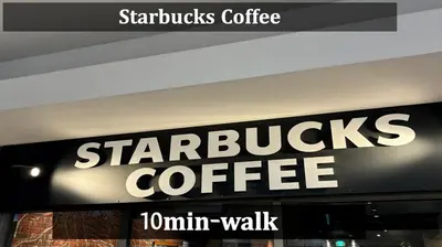 a starbucks coffee sign on the side of a store at Yama Hotel Akabane 201 in Tokyo
