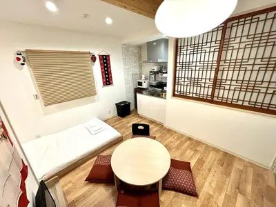 a small room with a table and a kitchen at Yama Hotel Akabane 201 in Tokyo