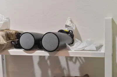 a pair of sunglasses sitting on top of a shelf at Aoi Bld 1F in Tokyo