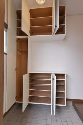 a walk in closet with white cabinets and shelves at Aoi Bld 2F in Tokyo