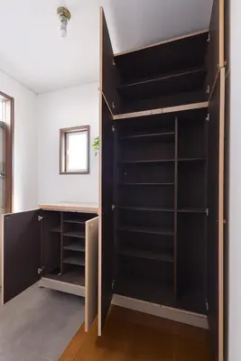 a closet with black shelves in a room at Aoi Bld 3F in Tokyo
