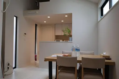 a dining room with a table with chairs and water bottles at Tabi in Tokyo in Tokyo