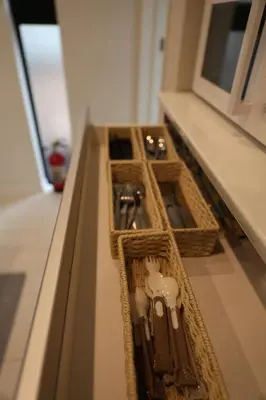 a shelf with threeartmentsbestos at Tabi in Tokyo in Tokyo