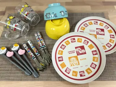 a table with a plate and utensils and a toy at Higashi-Ikebukuro Japanese Style in Tokyo