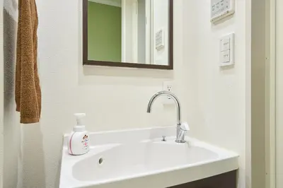 a bathroom with a white sink and a mirror at K2 4min from sta 7min to shinjuku sta quiet area in Tokyo