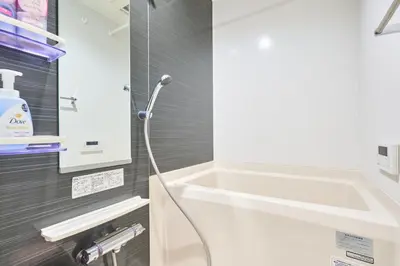 a bathroom with a bath tub and a sink at K2 4min from sta 7min to shinjuku sta quiet area in Tokyo