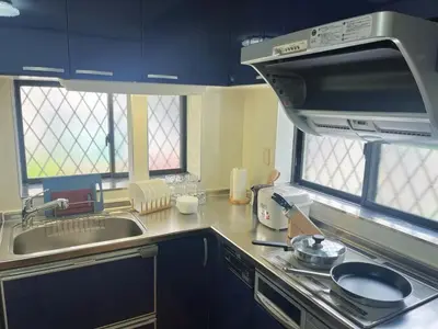 a kitchen with a sink and a stove top oven at JW-One Skytree in Tokyo