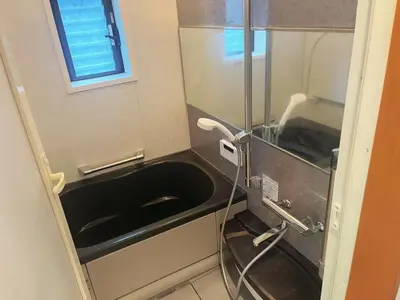 a bathroom with a black sink and a mirror at JW-One Skytree in Tokyo