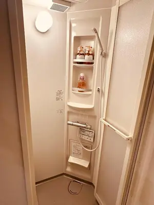 a refrigerator with its door open in a room at \u963f\u4e45\u6d25\u30cf\u30a4\u30c4102 in Tokyo