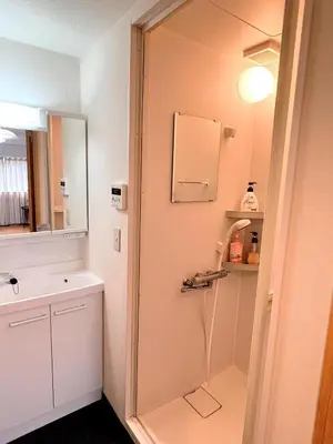 a bathroom with a shower and a sink at Walking distance to Sunshine, families are welcome and easy to live in in Tokyo