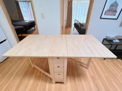 a large wooden table in a living room at Walking distance to Sunshine, families are welcome and easy to live in in Tokyo