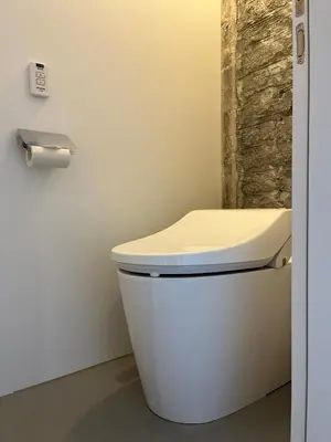 a bathroom with a white toilet in a room at MIDORIso Nihonbashi in Tokyo
