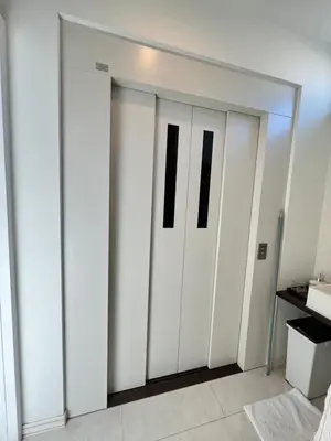 a pair of white sliding doors in a room at Private Room with elevator only 2 minutes to station in Tokyo