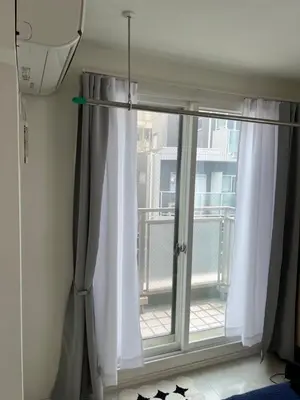 a window with white curtains in a room at Private Room with elevator only 2 minutes to station in Tokyo