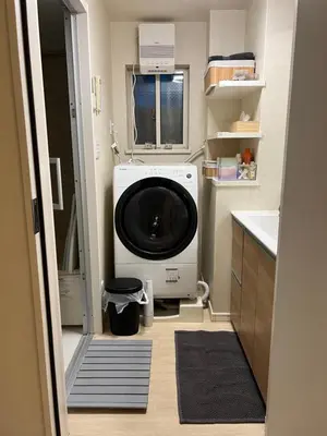 a washer and dryer in a small kitchen at Private Room with elevator only 2 minutes to station in Tokyo