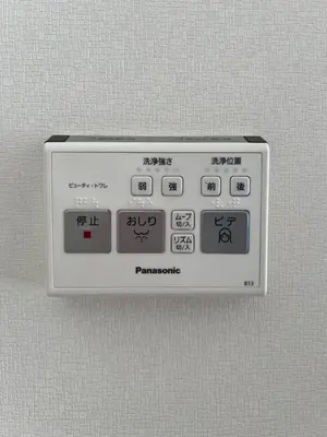 a remote control is attached to a wall at Private Room with elevator only 2 minutes to station in Tokyo