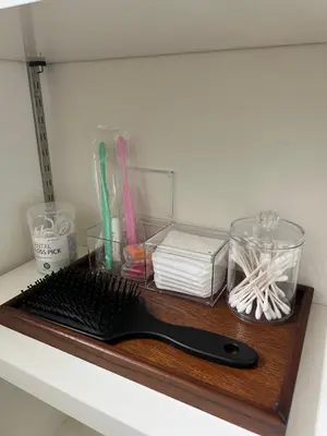 a wooden shelf with a black keyboard and other items at Private Room with elevator only 2 minutes to station in Tokyo