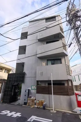 a tall gray building on the side of a street at 3A SHIBUYA Cozy Bright Apartment, 28sqm, free wifi, MAX 5PP in Tokyo
