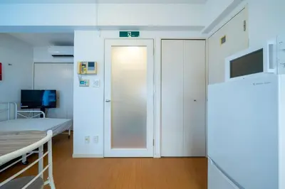 a hospital room with a bed and a door at 3A SHIBUYA Cozy Bright Apartment, 28sqm, free wifi, MAX 5PP in Tokyo