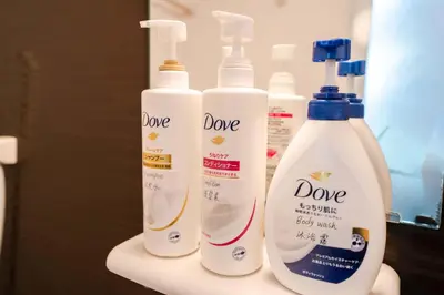 three bottles of deodorant on a shelf in a bathroom at 2 bedrooms and 1 living room on the 1st floor, 40sqm house, 10 min walk to Oji 2 min walk to Kajiyara Toden Arakawa Line in Wada