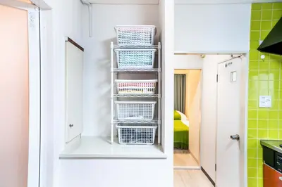 a kitchen with a stack of baskets on a shelf at 2 bedrooms and 1 living room on the 1st floor, 40sqm house, 10 min walk to Oji 2 min walk to Kajiyara Toden Arakawa Line in Wada