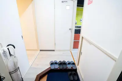 a stairway with a blue rug in a room at 2 bedrooms and 1 living room on the 1st floor, 40sqm house, 10 min walk to Oji 2 min walk to Kajiyara Toden Arakawa Line in Wada