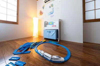 a toy train on the floor in a room at UNITEDCUBE STAY TOKYO Private urban vacation home in Tokyo