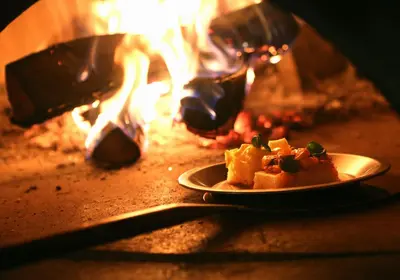a plate of food in front of a fire at Daiwa Roynet Hotel Ginza PREMIER in Tokyo