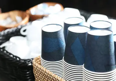 a basket filled with black and white paperaments at Daiwa Roynet Hotel Ginza PREMIER in Tokyo
