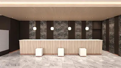 a lobby with a reception desk in a building at Daiwa Roynet Hotel Ginza PREMIER in Tokyo