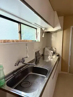 a kitchen with a sink and a window at aiki house in Tokyo