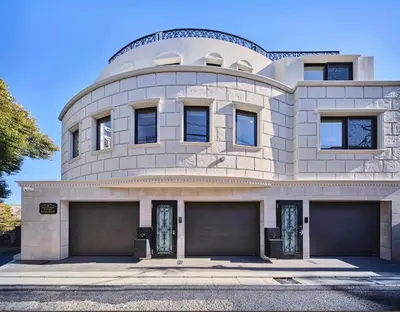 a building with two garage doors in front of it at IoTele Minami-Aoyama in Tokyo